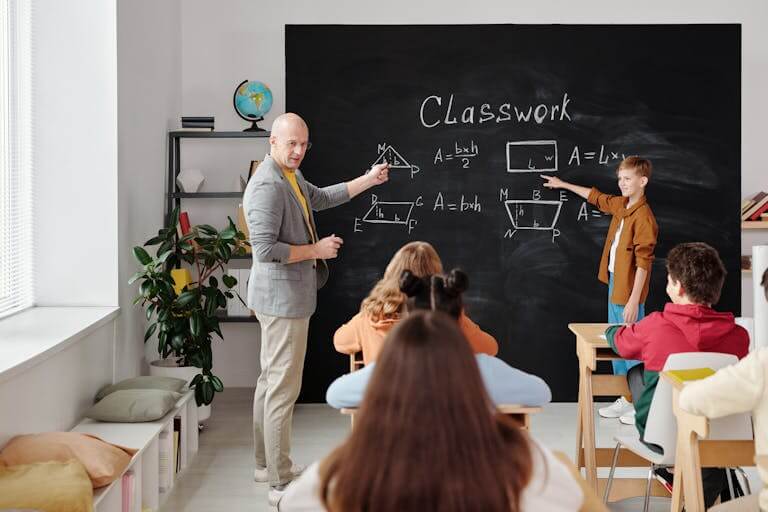 A teacher and students in a classroom during a geometry lesson, focused and engaging.